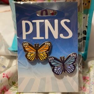 Two butterfly pins